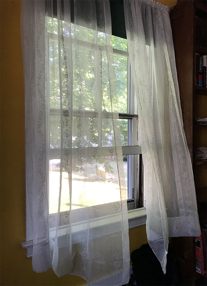 Old House Window with Sheer Curtains in Window
